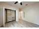 Bright bedroom with vinyl floors, a ceiling fan, and a walk-in closet at 16431 Enclave Village Dr # 16431, Tampa, FL 33647