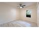 Bright bedroom with vinyl floors, a ceiling fan, and a window at 16431 Enclave Village Dr # 16431, Tampa, FL 33647