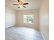 Bedroom with closet, bright window, and new vinyl floors at 16431 Enclave Village Dr # 16431, Tampa, FL 33647