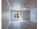 Bright and airy bedroom featuring a ceiling fan and hardwood-style flooring at 16431 Enclave Village Dr # 16431, Tampa, FL 33647