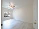Bedroom featuring new vinyl floors, ceiling fan, and bright window at 16431 Enclave Village Dr # 16431, Tampa, FL 33647