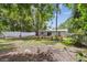 Well-maintained backyard with a privacy fence, landscaping, and a view of the house's exterior at 1817 West Dr, Clearwater, FL 33755