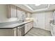 Well-lit kitchen with stainless steel appliances, light wood cabinets, and a stylish countertop at 1817 West Dr, Clearwater, FL 33755