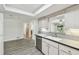 Kitchen area featuring lots of natural light and wood tile flooring at 1817 West Dr, Clearwater, FL 33755