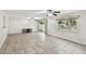 Spacious living room with tile flooring, multiple ceiling fans, and natural light at 1817 West Dr, Clearwater, FL 33755