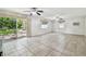 Spacious living room with tile flooring, ceiling fans, and natural light at 1817 West Dr, Clearwater, FL 33755