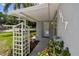 Close up of front door with garden lattice and view of number 1817 with porch cover at 1817 West Dr, Clearwater, FL 33755