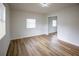 Bright bedroom with new flooring and closet with mirrored doors offers a modern and fresh appeal at 1820 Douglas Ave, Clearwater, FL 33755