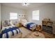 Cozy bedroom with two twin beds, colorful decor, and plenty of space for play at 1820 Douglas Ave, Clearwater, FL 33755