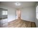 Bedroom featuring closet with mirrored doors, fresh paint and new flooring at 1820 Douglas Ave, Clearwater, FL 33755