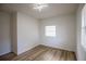 Bright bedroom with modern lighting and new wood flooring, offering a comfortable and stylish retreat at 1820 Douglas Ave, Clearwater, FL 33755