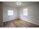 Inviting bedroom with ample natural light, new flooring, and clean, freshly painted walls at 1820 Douglas Ave, Clearwater, FL 33755