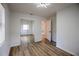 Bright bedroom features new flooring, closet with mirrored doors, and freshly painted walls at 1820 Douglas Ave, Clearwater, FL 33755