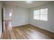 This bedroom boasts new flooring, plenty of natural light and access to other rooms at 1820 Douglas Ave, Clearwater, FL 33755