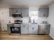 Modern kitchen with granite countertops, stainless steel appliances, and ample cabinet space at 1820 Douglas Ave, Clearwater, FL 33755