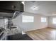 Bright kitchen with granite countertops, stainless steel appliances, and an open layout at 1820 Douglas Ave, Clearwater, FL 33755