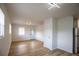 Open-concept living area with hardwood floors, natural light, and a modern, minimalist design at 1820 Douglas Ave, Clearwater, FL 33755