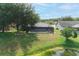 A beautiful backyard featuring a pool and screen enclosure, perfect for relaxing and enjoying outdoor living at 1949 Tampa Bay Dr, Wesley Chapel, FL 33543