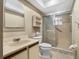 Neutral bathroom with a single vanity, toilet, and walk-in shower at 1949 Tampa Bay Dr, Wesley Chapel, FL 33543