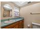 Bathroom with a vanity, large mirror, and toilet at 1949 Tampa Bay Dr, Wesley Chapel, FL 33543