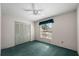 Bedroom with double door closet, a window, and ceiling fan at 1949 Tampa Bay Dr, Wesley Chapel, FL 33543