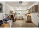 The garage features white block walls, overhead lighting, and plenty of storage space at 1949 Tampa Bay Dr, Wesley Chapel, FL 33543