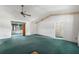Bright living room features a ceiling fan and sliding glass doors to the outside at 1949 Tampa Bay Dr, Wesley Chapel, FL 33543