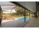 Enjoy this caged pool with a jacuzzi and a pretty view of a body of water at 1949 Tampa Bay Dr, Wesley Chapel, FL 33543