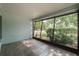 This beautiful porch has a grey-painted wall and tiled floors at 1949 Tampa Bay Dr, Wesley Chapel, FL 33543