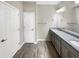 Bathroom features granite counters, double sinks, and gray cabinets at 19664 Ship Wheel Way, Land O Lakes, FL 34638