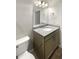 Updated bathroom featuring a granite vanity, modern fixtures, and a well-lit mirror at 19664 Ship Wheel Way, Land O Lakes, FL 34638