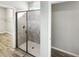 Bathroom features tiled shower and a closet with shelving at 19664 Ship Wheel Way, Land O Lakes, FL 34638