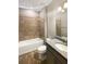 Well-lit bathroom showcasing a tiled shower, granite countertop vanity, and modern fixtures at 19664 Ship Wheel Way, Land O Lakes, FL 34638
