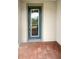 Close-up of a stylish front door with decorative glass and secure locking mechanisms, on a brick-paved porch at 19664 Ship Wheel Way, Land O Lakes, FL 34638