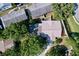 Aerial view showcasing the property's roof, landscaping, and surrounding neighborhood at 2031 Dover Ct, Oldsmar, FL 34677