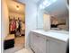 Updated bathroom features modern vanity with white countertop and large mirror at 2031 Dover Ct, Oldsmar, FL 34677