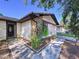 Charming home with a well-maintained yard and a stone accent near the entrance at 2031 Dover Ct, Oldsmar, FL 34677