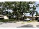 Charming home featuring a lush front lawn and an inviting driveway at 2031 Dover Ct, Oldsmar, FL 34677