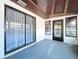 Enclosed patio features sliding glass doors and a ceiling fan at 2031 Dover Ct, Oldsmar, FL 34677
