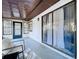 Enclosed patio features sliding glass doors and a ceiling fan at 2031 Dover Ct, Oldsmar, FL 34677