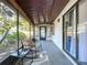 Relaxing screened-in patio area with comfortable seating and a view of the lush backyard at 2031 Dover Ct, Oldsmar, FL 34677