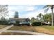 Community pool offers a refreshing retreat amidst lush landscaping and clear skies at 2031 Dover Ct, Oldsmar, FL 34677