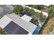 Aerial view of backyard showing patio furniture and a white privacy fence at 2066 High Ridge Dr, Clearwater, FL 33763