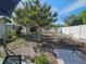 Backyard with sparse lawn, white fence, and outdoor seating at 2066 High Ridge Dr, Clearwater, FL 33763