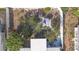 Aerial view showcasing outdoor dining and seating area with a white privacy fence at 2066 High Ridge Dr, Clearwater, FL 33763