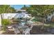 Enclosed backyard featuring an outdoor dining space, barbecue, and privacy fence at 2066 High Ridge Dr, Clearwater, FL 33763