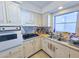Kitchen area showcasing stainless steel appliances and a modern sink at 2066 High Ridge Dr, Clearwater, FL 33763