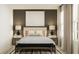 Bedroom features modern decor, warm lighting, and large windows at 2284 Blue Grosbeak Pl, Wimauma, FL 33598