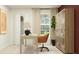 Well-lit home office showcasing a contemporary desk, storage cabinet, and view of the outdoors at 2284 Blue Grosbeak Pl, Wimauma, FL 33598