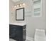 Bathroom featuring modern vanity, a framed mirror, and updated lighting at 243 45Th N St, St Petersburg, FL 33713
